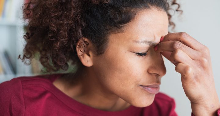 A woman experiencing symptoms and signs of a stroke