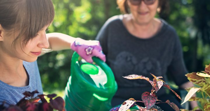 daughter gardens with her mother _ how to adjust kids summer schedules