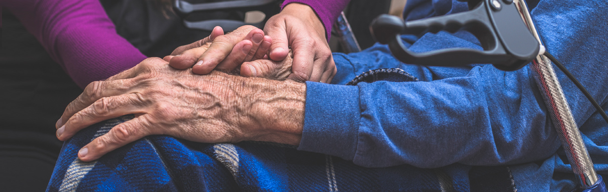 man and woman hold hands _ parkinsons disease