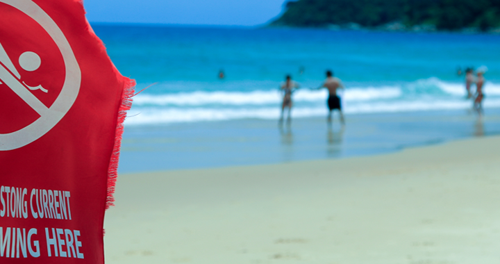 safety flag on a beach _ safety tips for different destination types