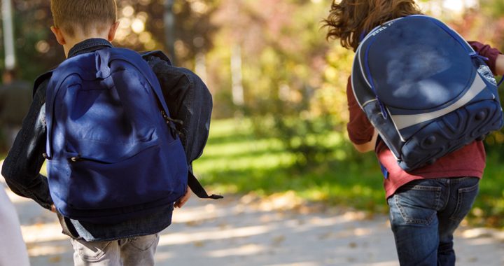 two kids walk with their backpacks _ backpack health tips mercy health