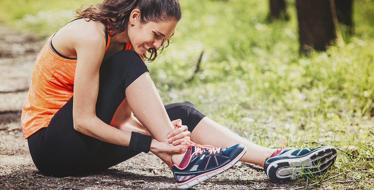 A woman experiencing ankle pain.