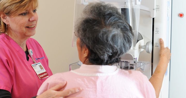 patient and health care worker talking during mammogram