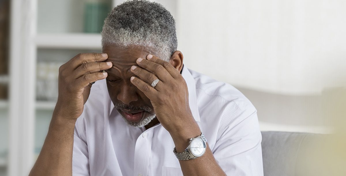 An older man experiencing vertigo