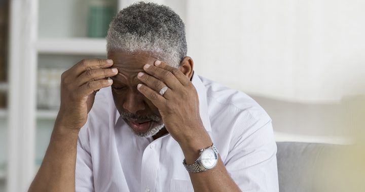 An older man experiencing vertigo