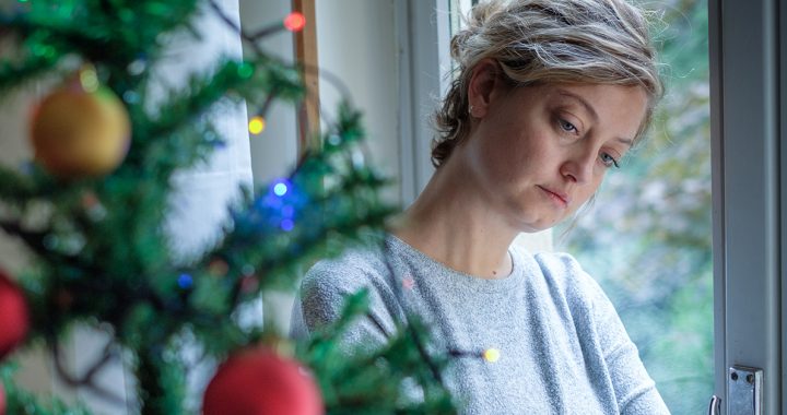 A woman grieving during the holidays