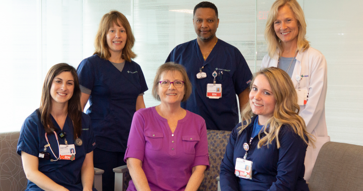 Nurses and a doctor surround Emily, a cancer patient who underwent CAR t-cell therapy