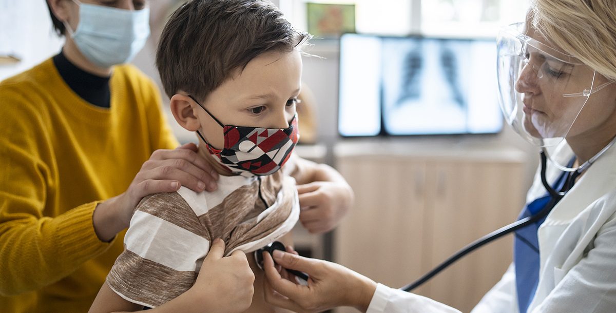 A child having their annual physical with their pediatrician