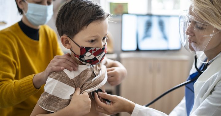 A child having their annual physical with their pediatrician