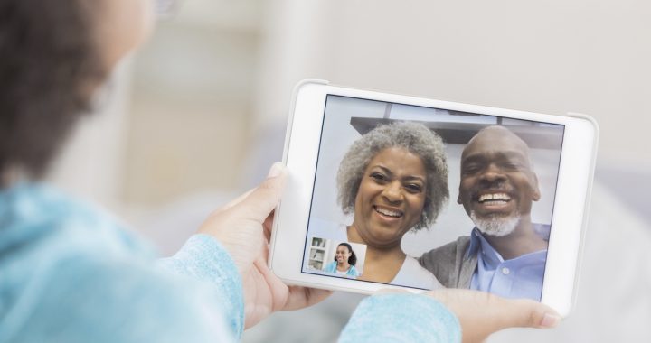 Grandchild video chatting with grandparents during social distancing