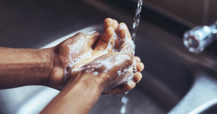 Person washing their hands at home