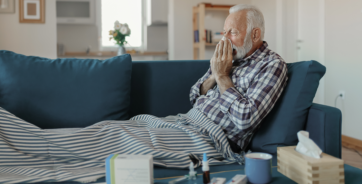 A man who is sick and taking care of himself at home