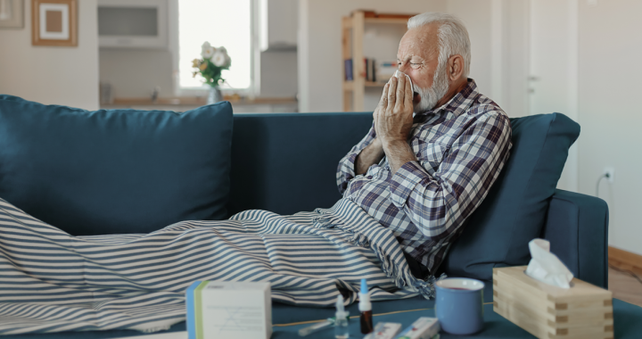 A man who is sick and taking care of himself at home