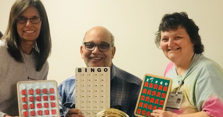 Tonya West with coworkers playing hallway bingo during COVID-19.