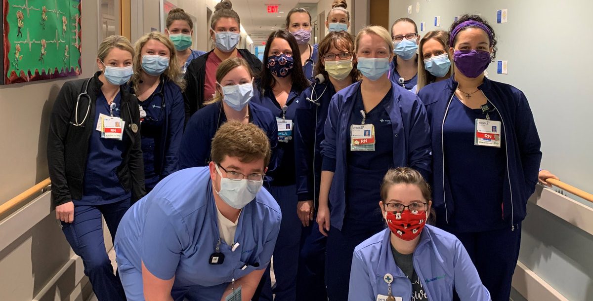 Group photo of Anderson Hospital nurses with masks on their unit during COVID-19