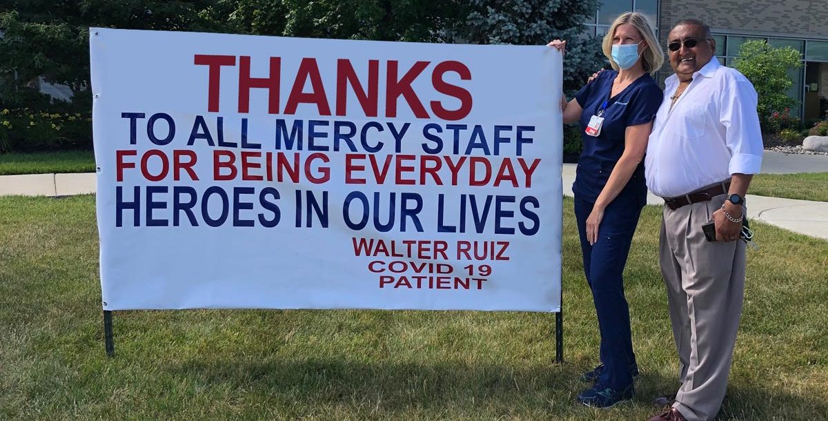 Walter Ruiz and Lisa Lane outside Fairfield Hospital by his sign.