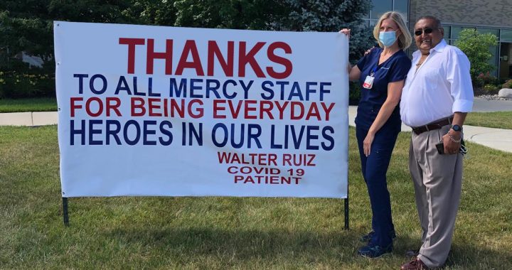 Walter Ruiz and Lisa Lane outside Fairfield Hospital by his sign.