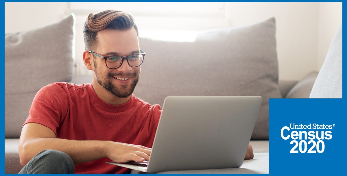 A man filling out his 2020 Census online at home.