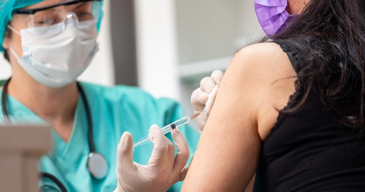 A person getting their flu shot during COVID-19.