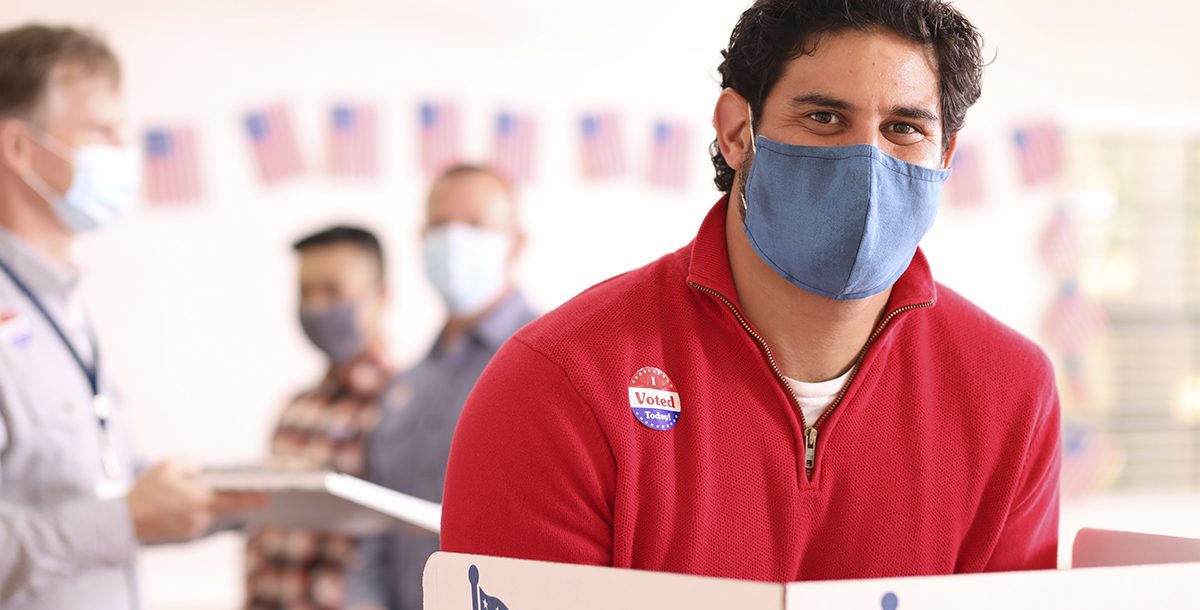 A man voting at the polls.