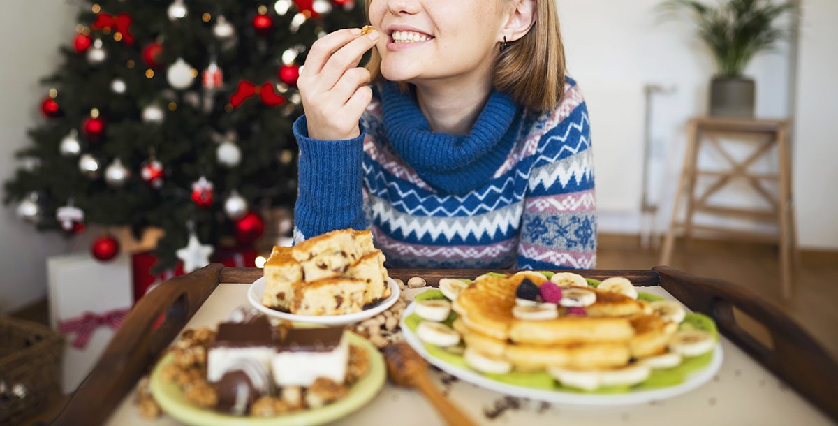 A woman enjoying holiday treats.