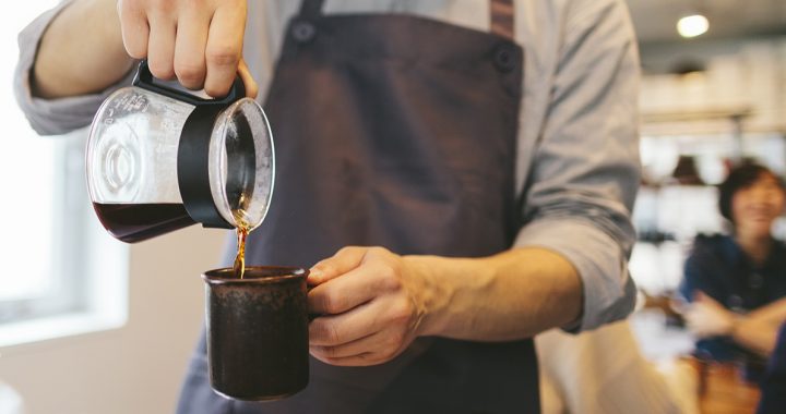 A man pouring coffee.