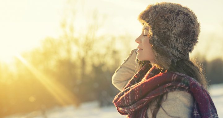 A person enjoying sunshine during the winter.