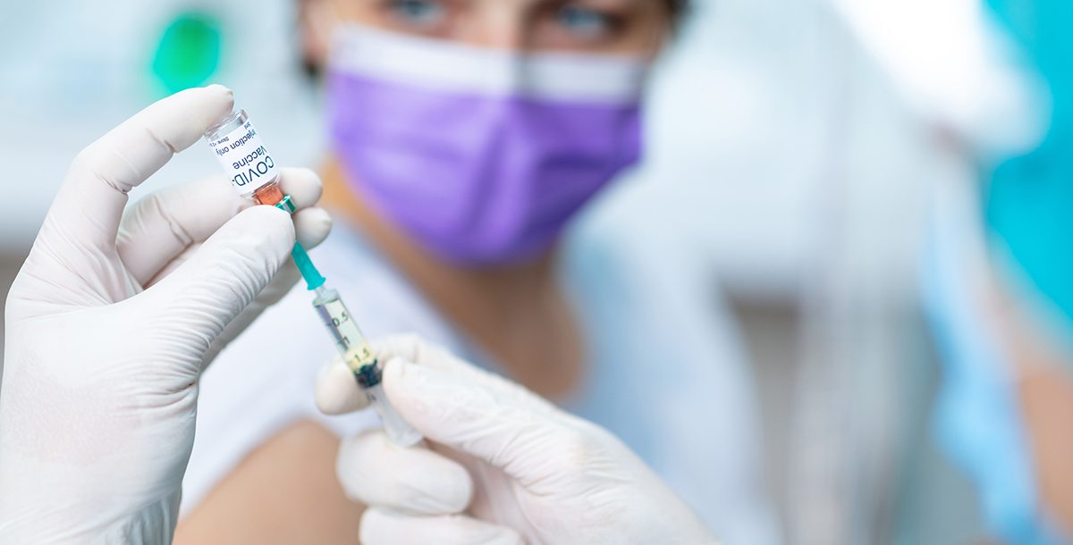 A person receiving the COVID-19 vaccine.