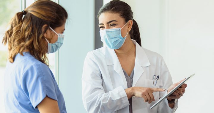 A patient meeting with a doctor about a colon cancer screening.