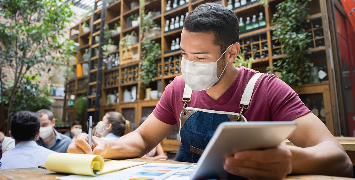 A man wearing a face mask in public.