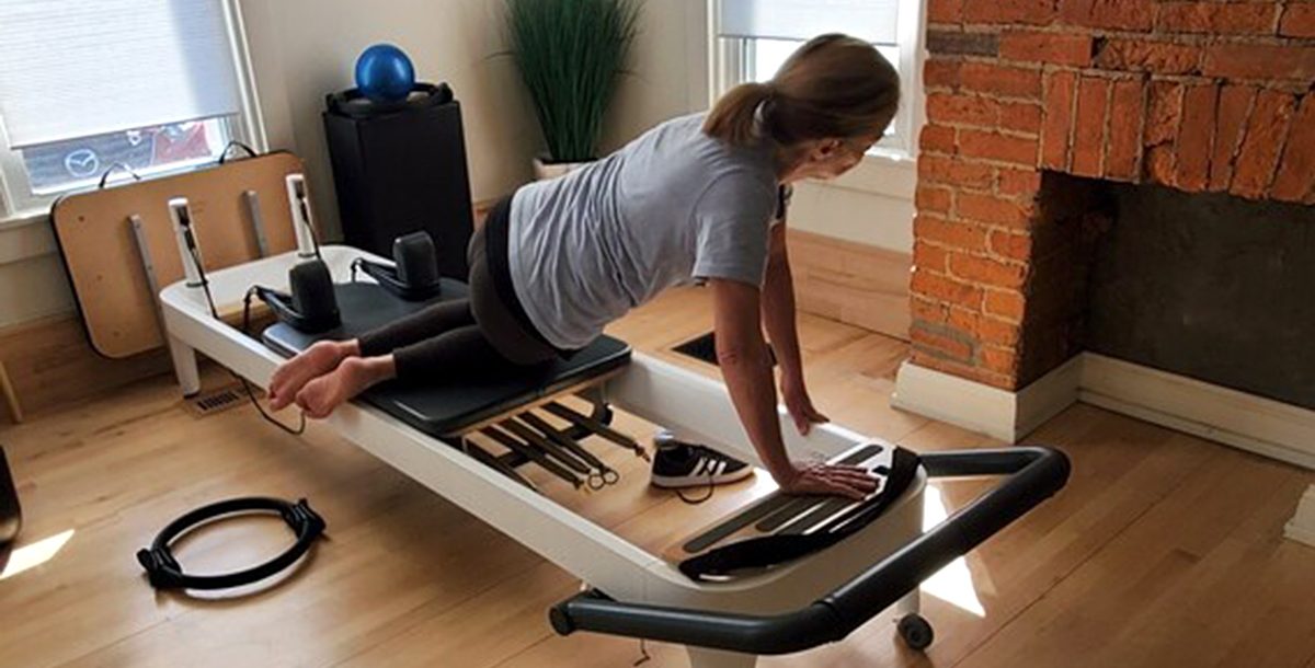 Charlotte Keller stretching at home.