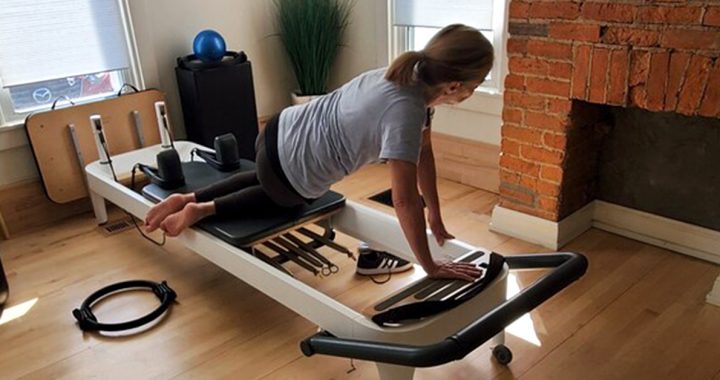 Charlotte Keller stretching at home.