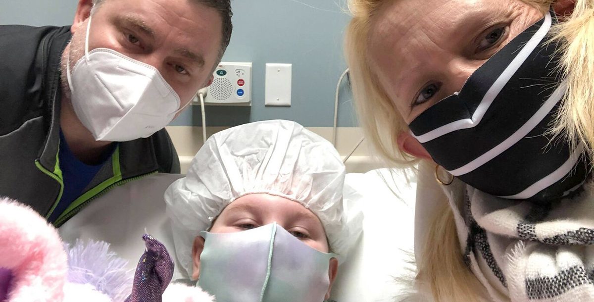 Lana Renollet with her parents just before surgery.