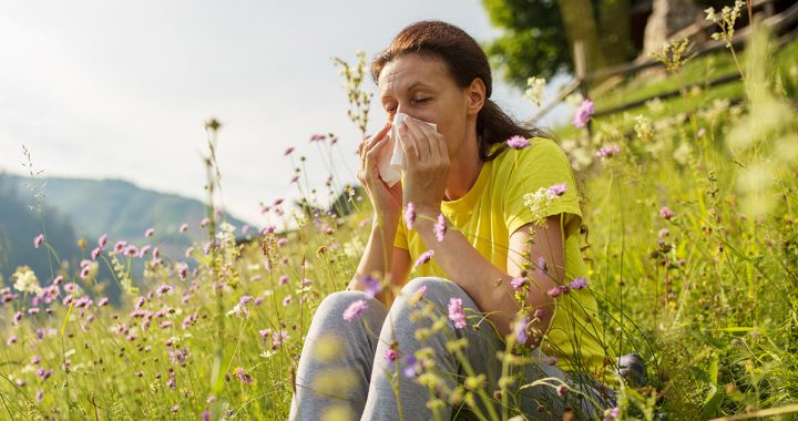 A woman experiencing spring allergies