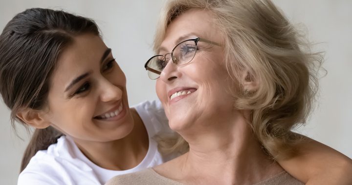 A mother and daughter embracing.