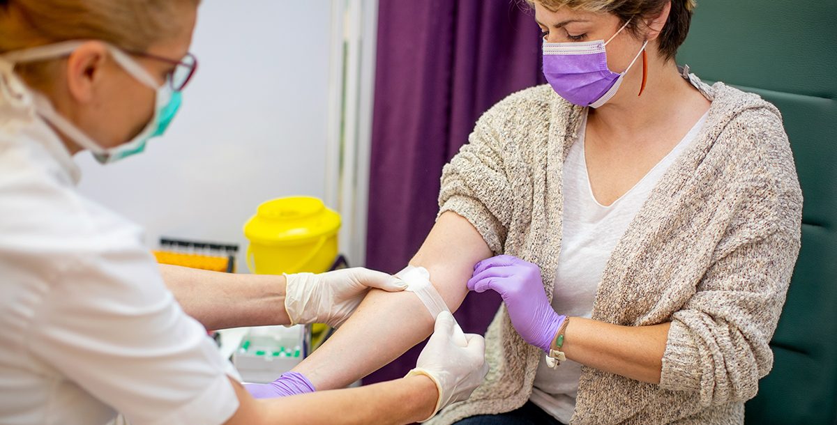 A woman donating blood.