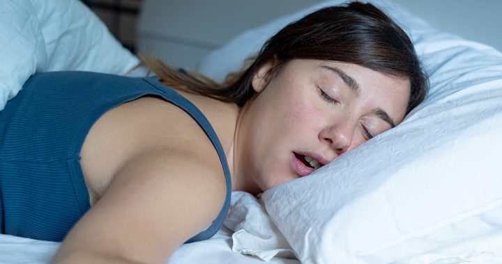 A person mouth breathing while sleeping.