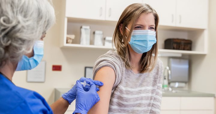 A woman getting her COVID-19 vaccine.