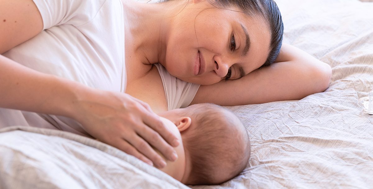 A mother breastfeeding her baby.