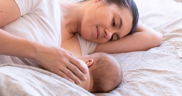 A mother breastfeeding her baby.