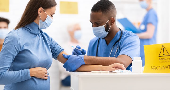 A pregnant woman getting vaccinated for COVID-19.