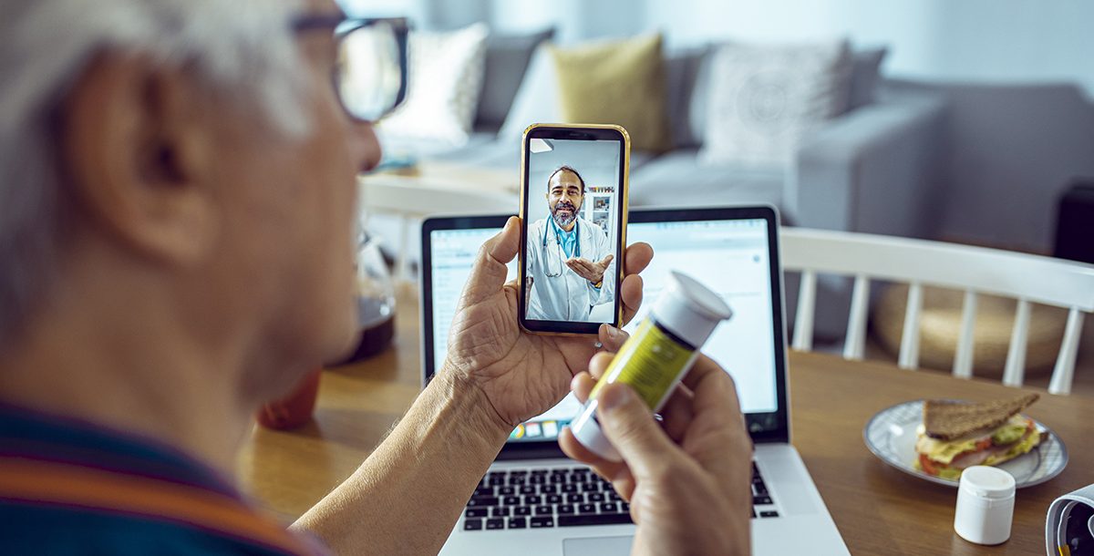 A person participating in a video visit with their primary care provider.