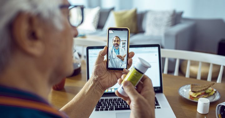 A person participating in a video visit with their primary care provider.