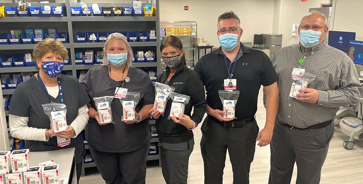 Lourdes Hospital team members with Narcan packets