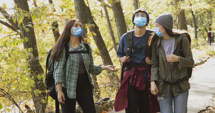 friends wearing face masks around each other