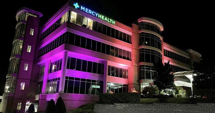 Purple light shining on the Marshall Nemer Medical Office building.