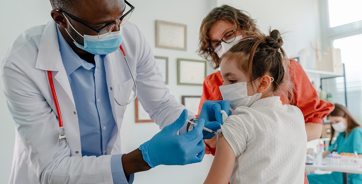 A kid getting vaccinated for COVID-19.