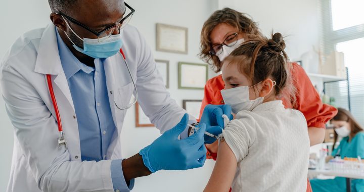 A kid getting vaccinated for COVID-19.