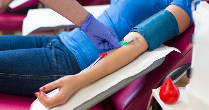 A person donating blood.