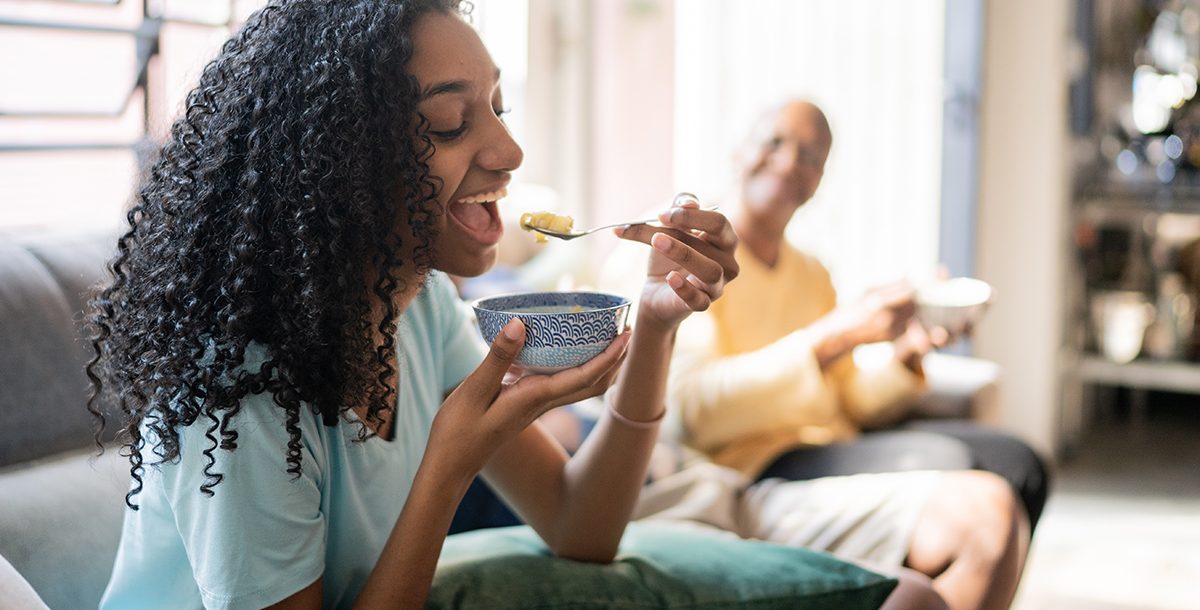 a person eating soup